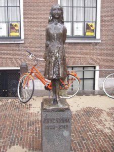 bronze statue of Anne Frank near her house