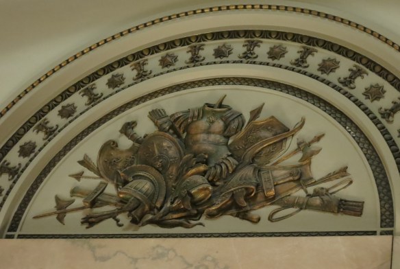 arches and piles of weapons