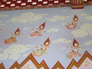 Asparas winging their way to the buddha up front