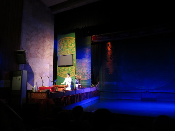 Narrator before the screen that hid the orchestra