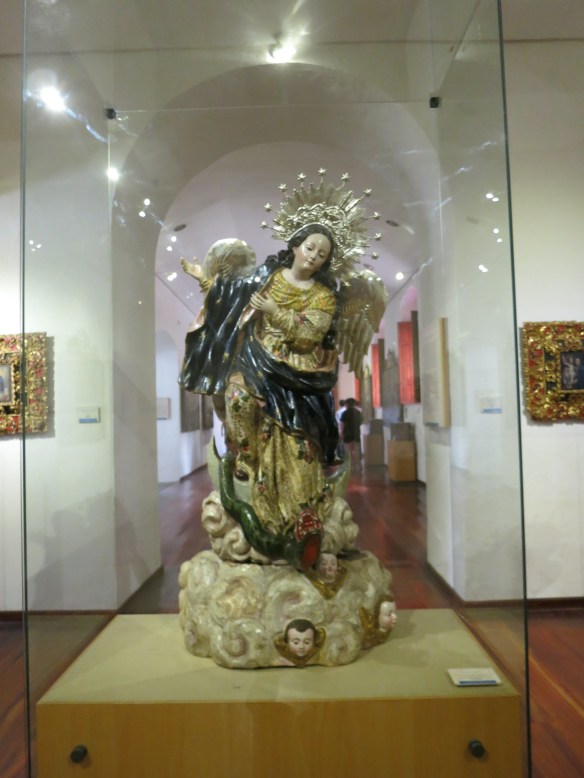 The specific pose for the Virgin of the Apocalypse (she has wings, and vanquishes a dragon)