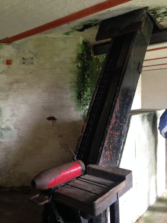 Old shells and the machine that used to carry them from storage up to the guns